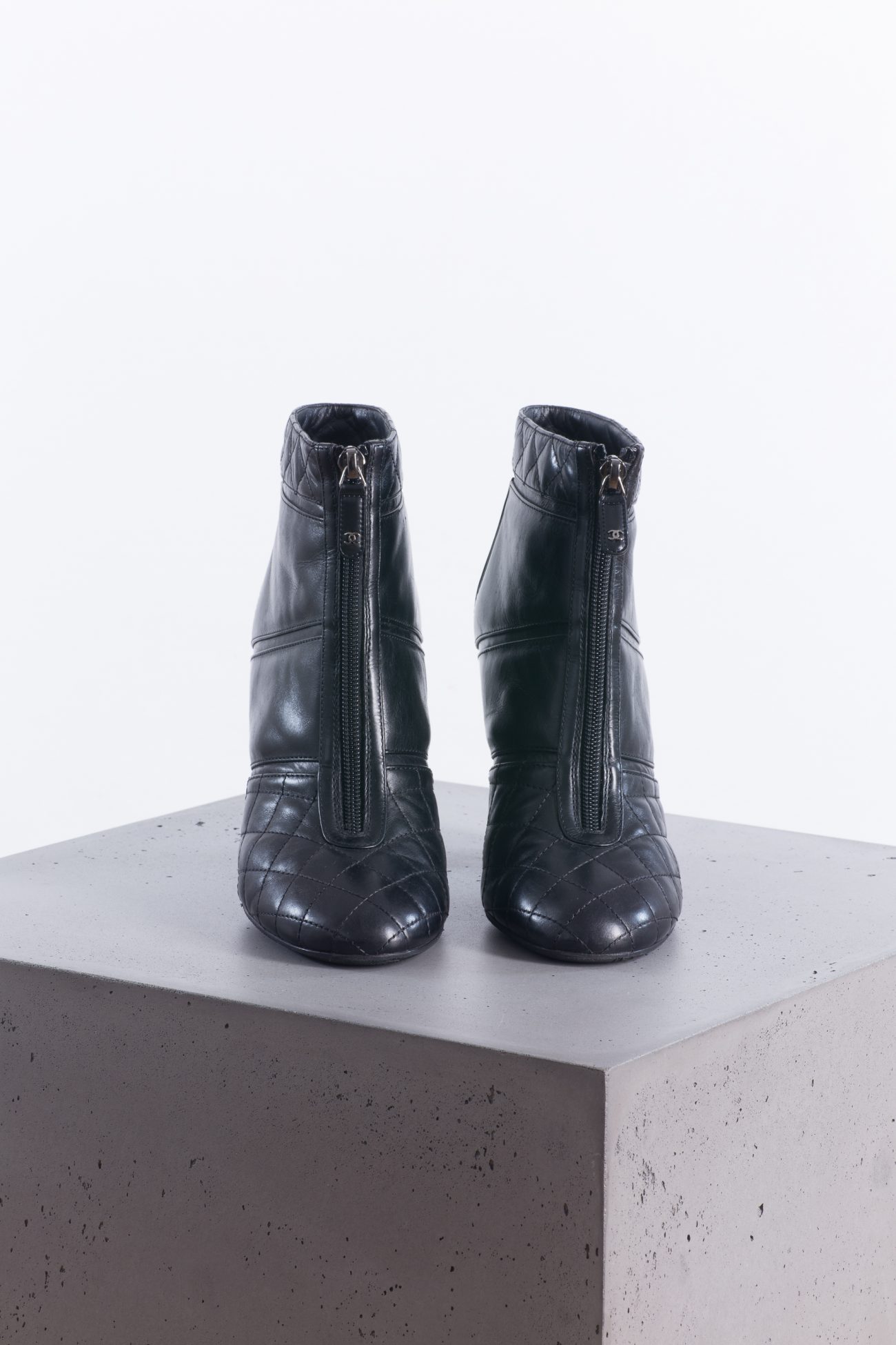 Chanel Black quilted leather front zip ankle boots