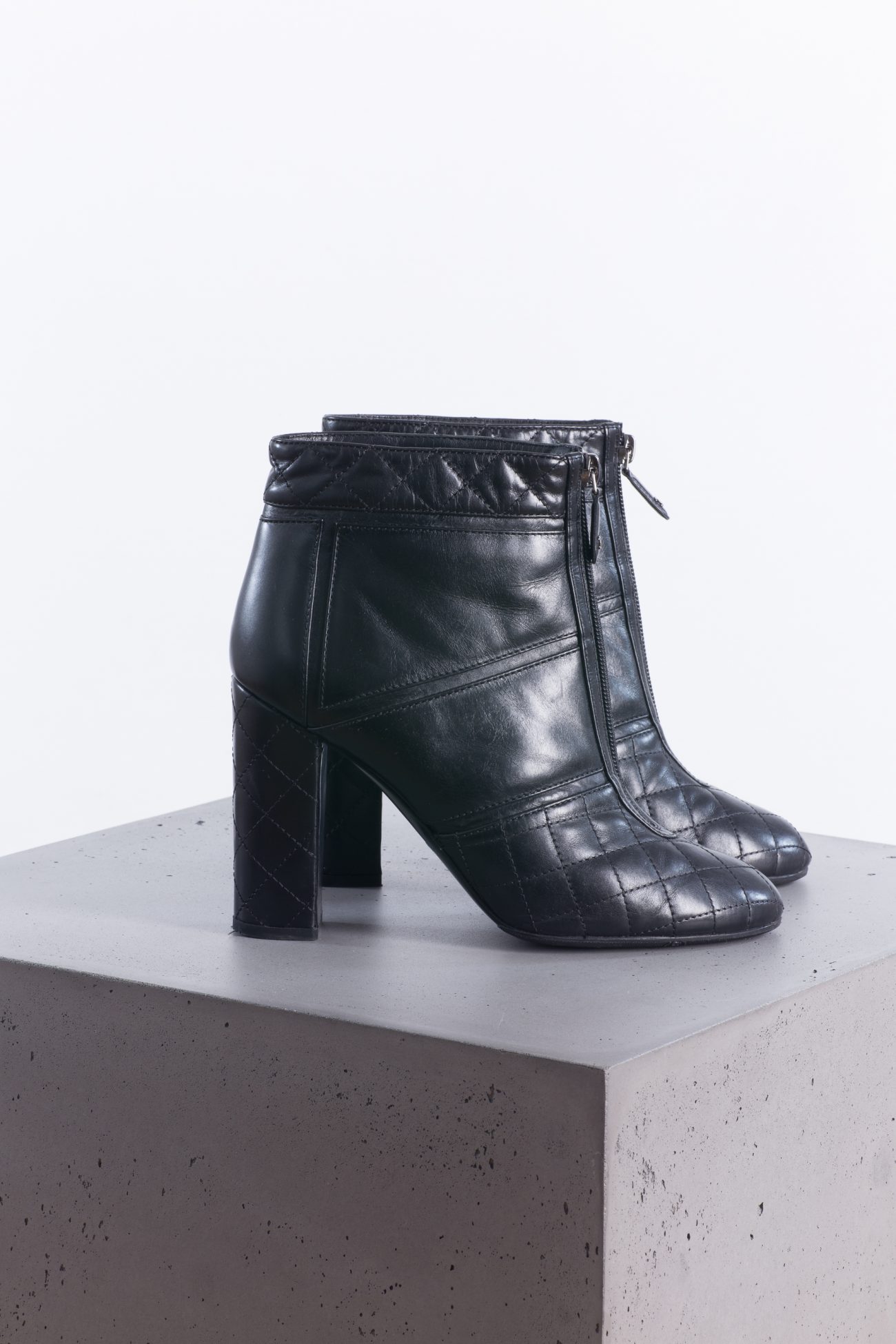 Chanel Black quilted leather front zip ankle boots