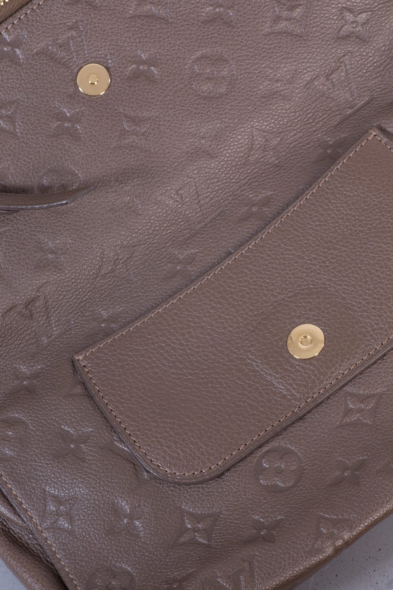 Louis Vuitton Petillante Monogram Empreinte fold-over clutch bag in taupe