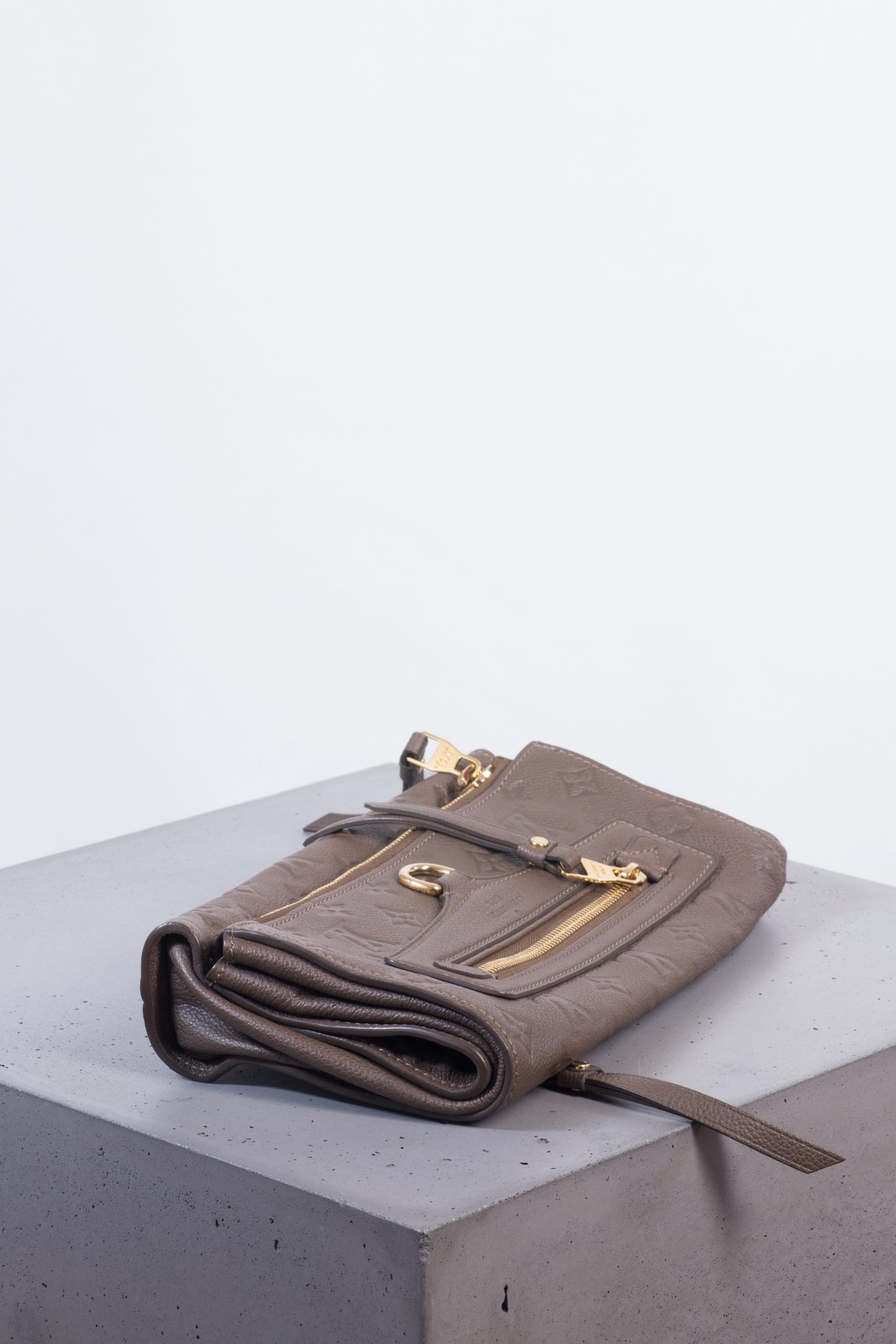 Louis Vuitton Petillante Monogram Empreinte fold-over clutch bag in taupe