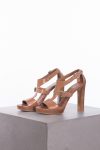 Prada Leather T-strap sandals in camel