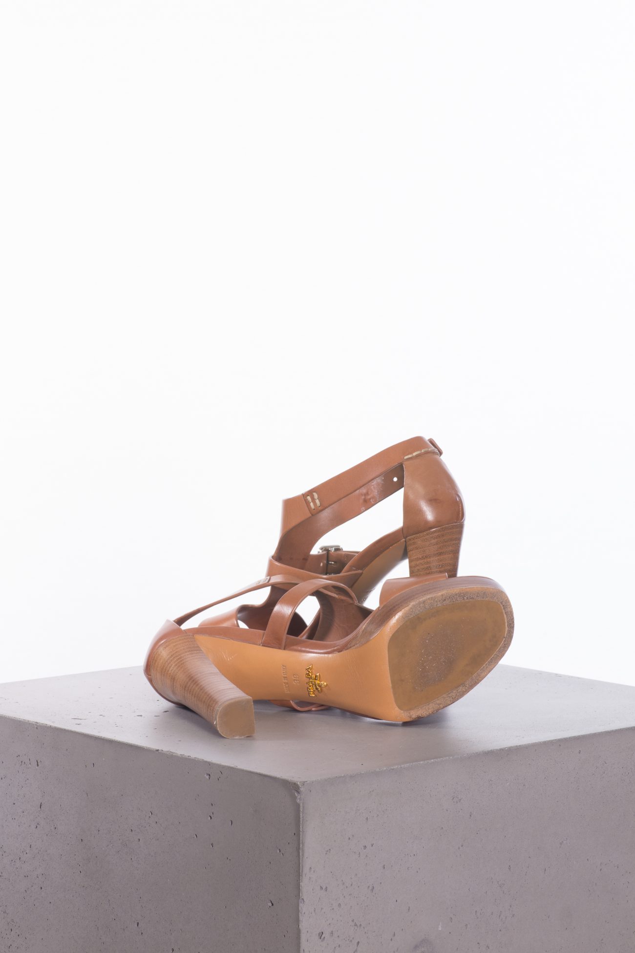 Prada Leather T-strap sandals in camel