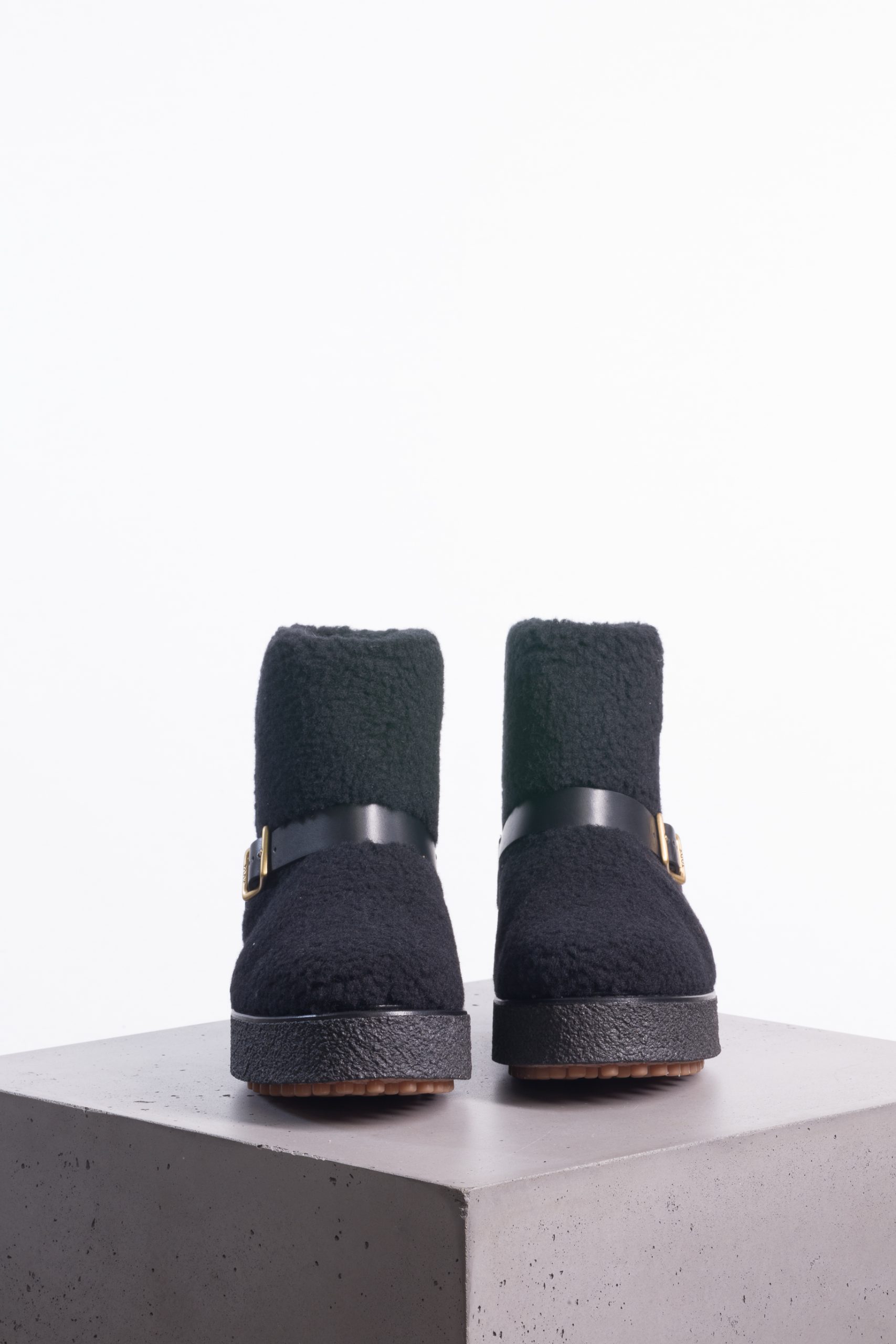 Tod’s Shearling Ankle Boots with Gold-Tone Buckle